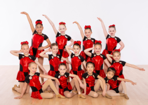 Level 1 Jazz Dancers in Posing Red and Black Recital Costume on Picture Day